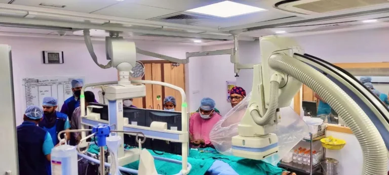 Dr. (Col) Ajay Bahadur conducting an advanced interventional cardiology procedure in a fully equipped cardiac catheterization laboratory in Lucknow